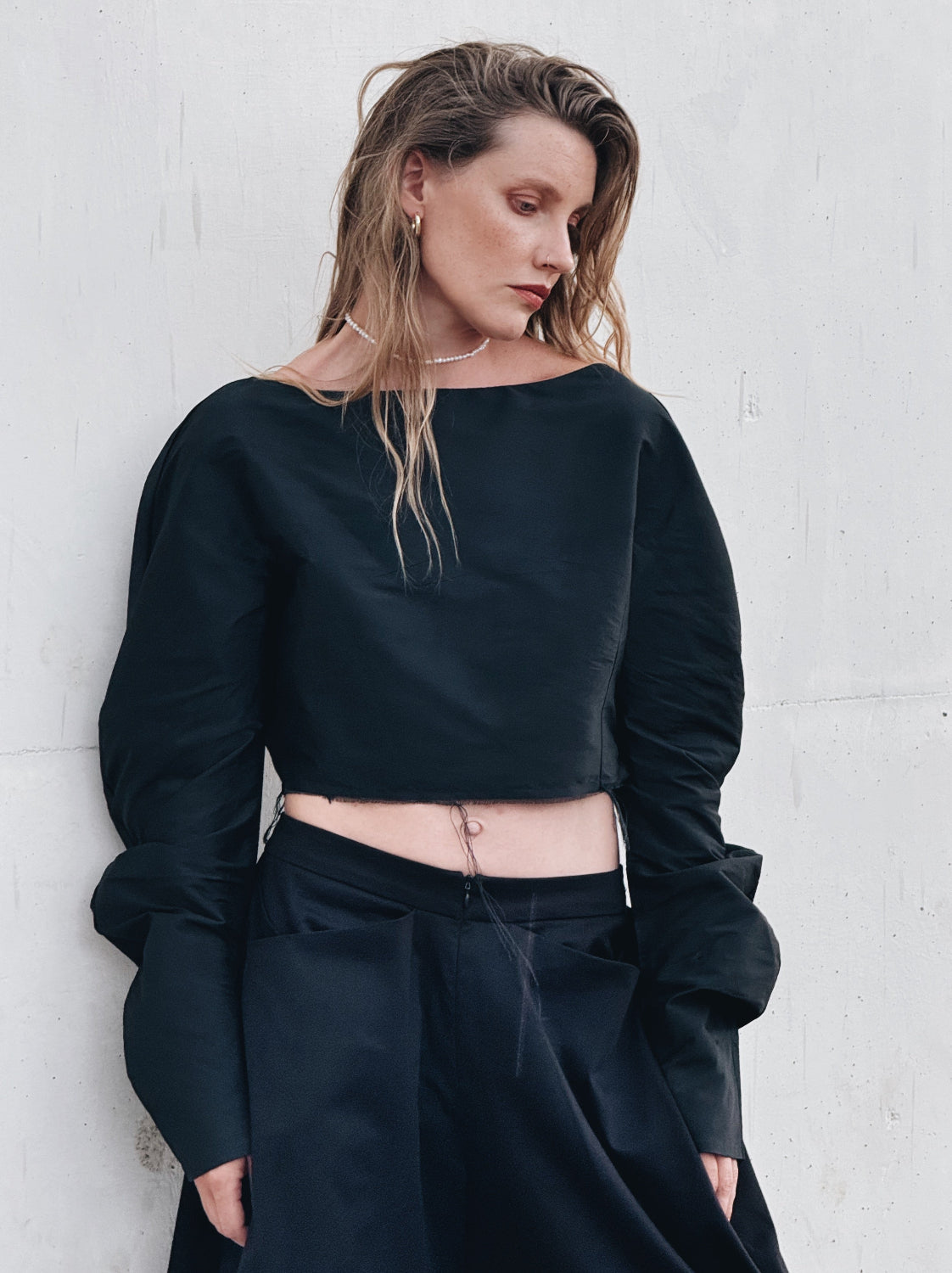Black silk taffeta cropped top with dramatic sleeves styled with wide-leg trousers - Sazha Barcelona