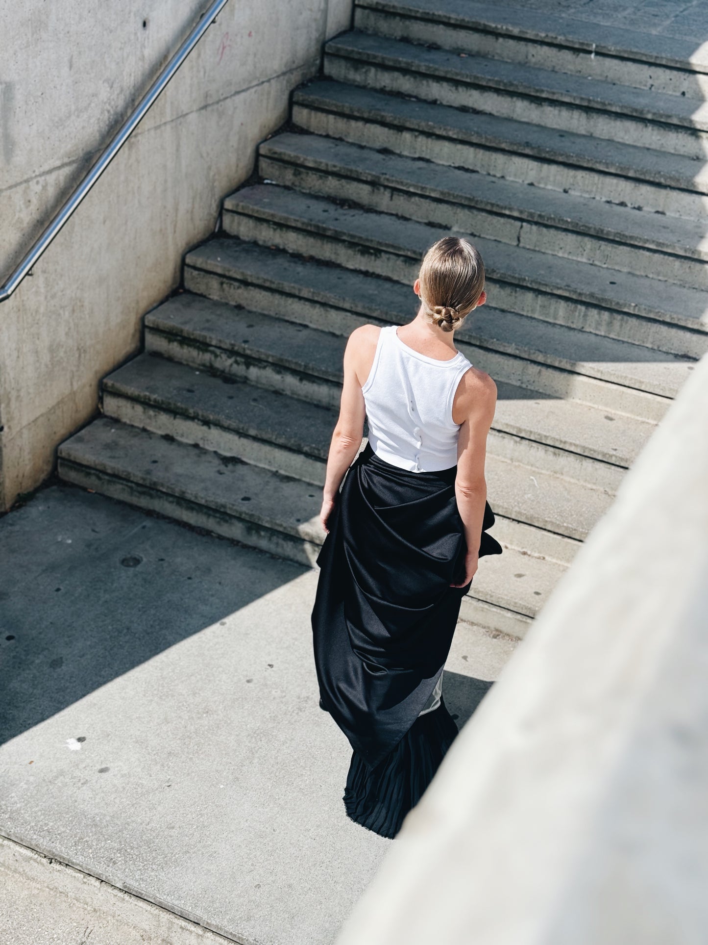Asymmetric Black Maxi Skirt with Draped Overlay and Pleated Hem