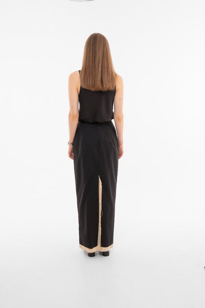 Back view of black maxi pencil skirt with deep back slit and contrast lining - luxury tailored skirt - Sazha Barcelona