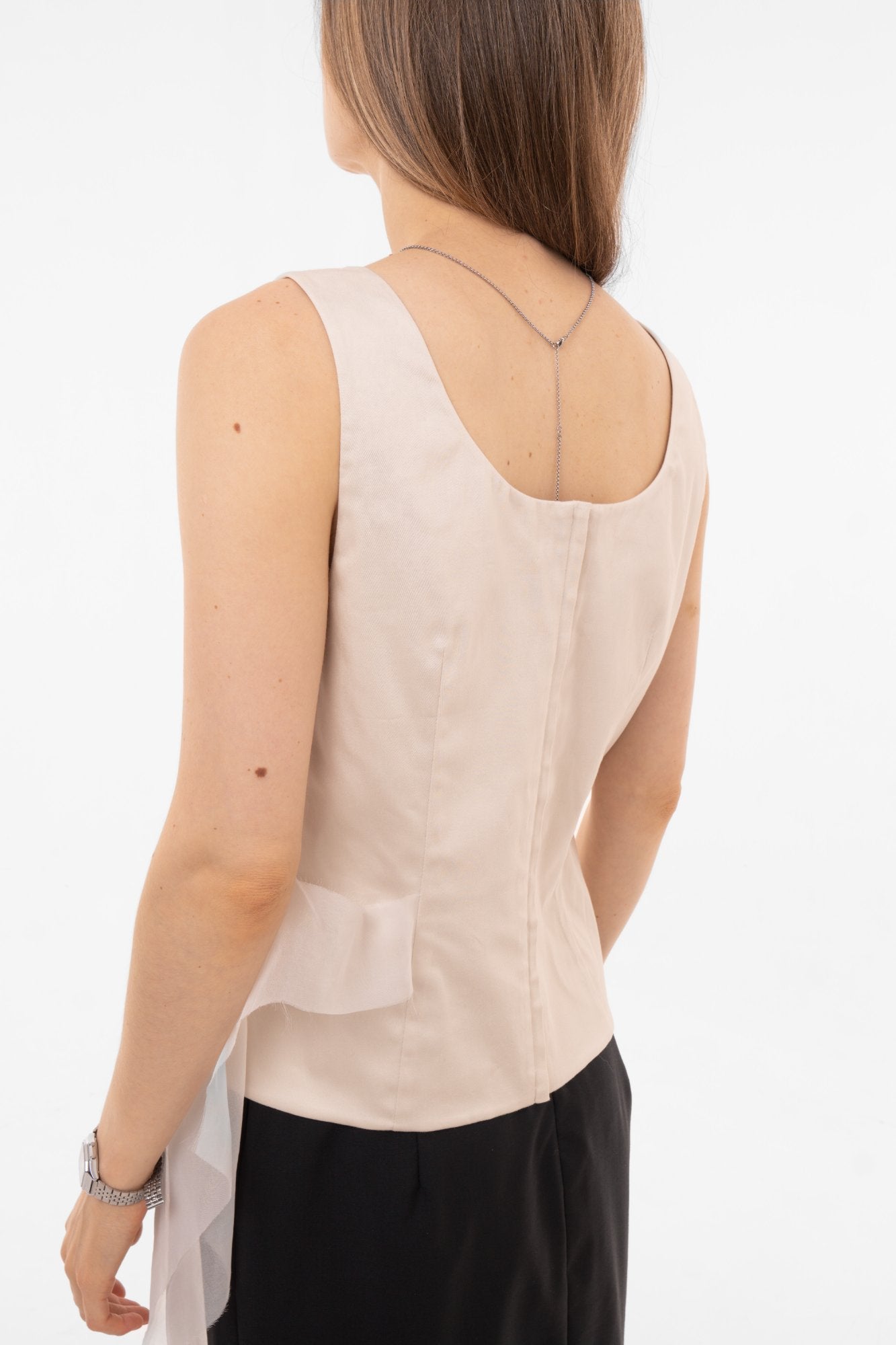 Back view of beige sleeveless cotton blouse with concealed zip closure and clean lines - Made in Spain