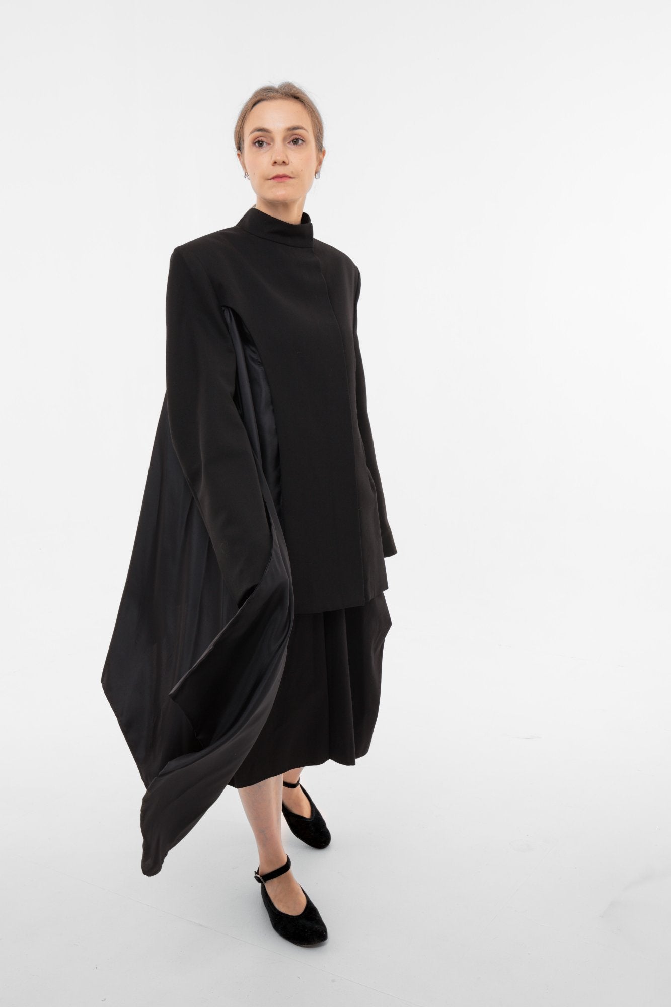 Architectural black blazer with stand collar sculptural draping and asymmetric satin lining - made in Barcelona