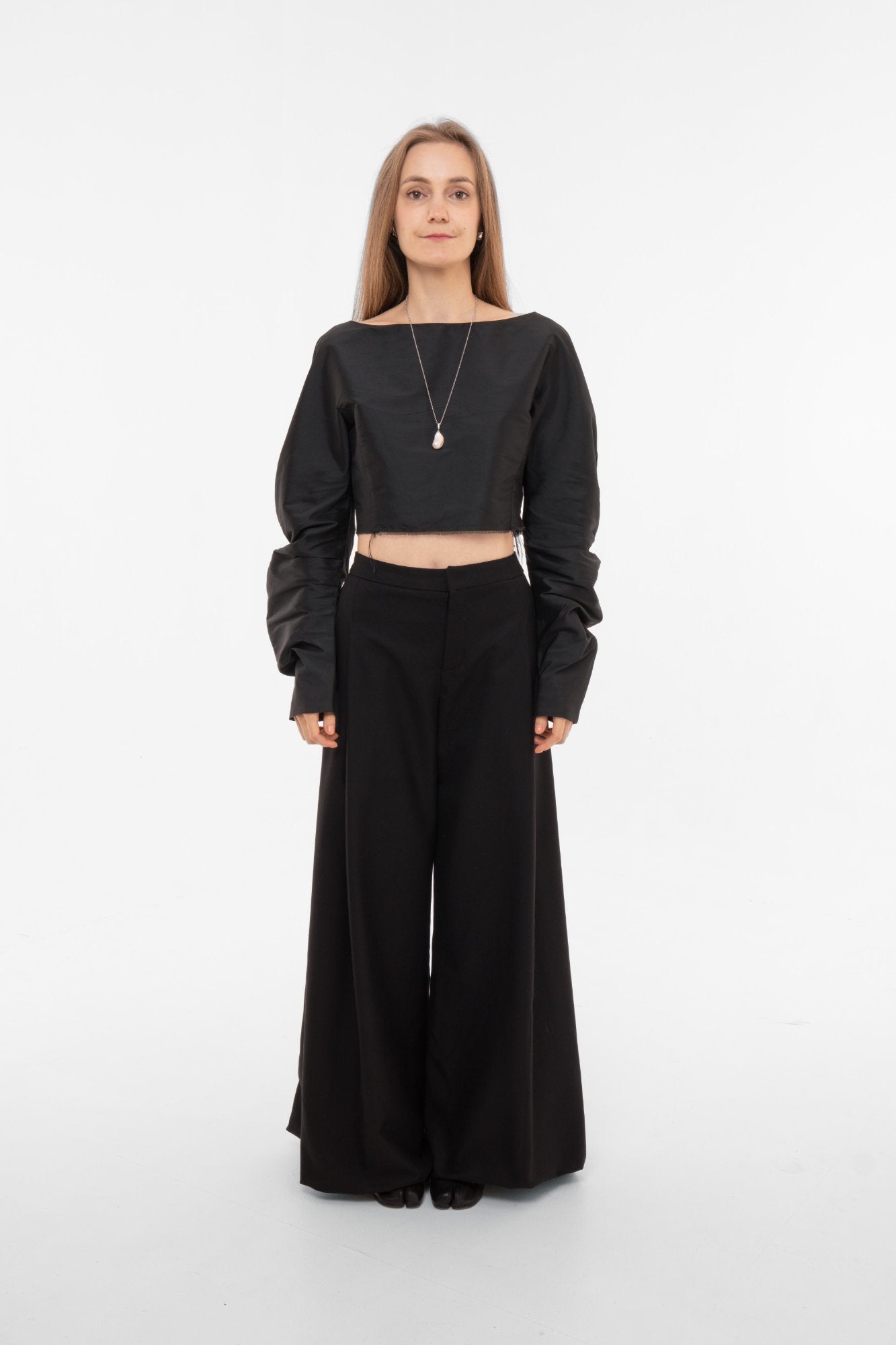 High-waist wide-leg palazzo trousers with cropped silk taffeta top - front view - avant-garde minimalist look